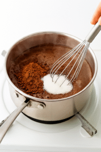 Add Cocoa and Sugar: Whisk in unsweetened cocoa powder and granulated sugar. Keep whisking until the mixture looks smooth and the cocoa is fully dissolved.