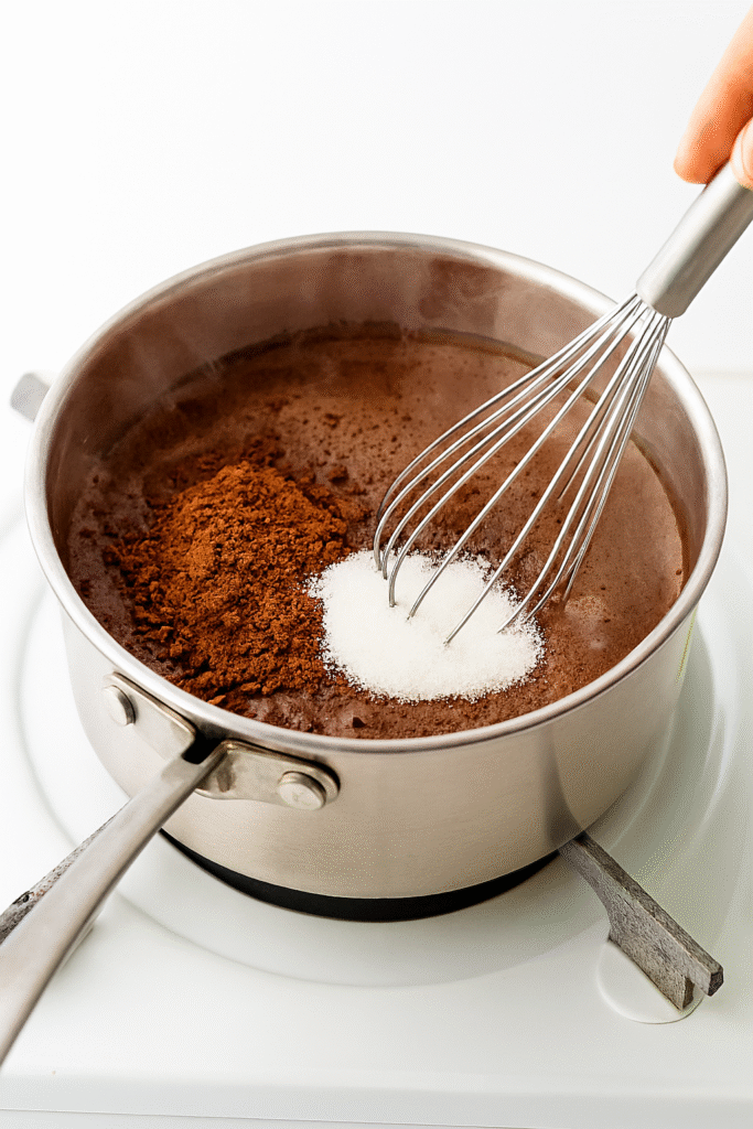 Add Cocoa and Sugar: Whisk in unsweetened cocoa powder and granulated sugar. Keep whisking until the mixture looks smooth and the cocoa is fully dissolved.