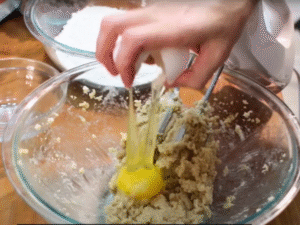 Mix in the eggs one at a time, then stir in vanilla extract for that signature flavor.