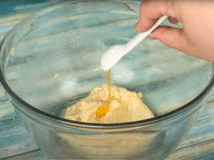 Scrape down the bowl, then mix in the egg, corn syrup, molasses, and vanilla until smooth and well blended.