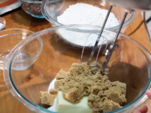 In a large bowl, beat softened butter with granulated sugar and brown sugar until light and fluffy.