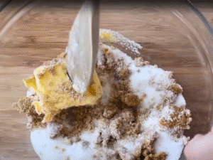 In a large mixing bowl, beat the softened butter with both sugars until light and fluffy.