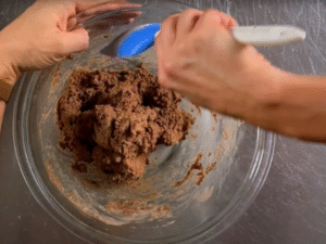 Pour in the melted cacao butter and add a little extra oat flour if needed. The dough should be soft but not sticky.