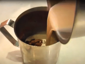 In a small saucepan, gently warm the milk and cream together until steaming (do not boil).