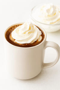 Serve with Whipped Cream: Pour into mugs, top with a swirl of whipped cream, and let it melt slightly into the cocoa for that signature diner‑style finish.