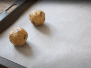 Scoop or roll the dough into balls and place them on a lined baking sheet, leaving space for spreading.