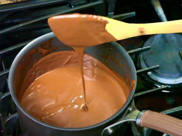 Sweeten & Enrich Whisk in sugar, cocoa powder, and ¼ cup heavy cream. Return to low heat, whisking until dissolved and silky.