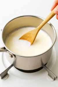 Warm the Milk: Pour whole milk (or your preferred milk) into a saucepan and heat gently over medium‑low. Stir occasionally to prevent scorching.