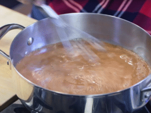 Warm the mixture over medium-low heat until it’s hot but not boiling, stirring often to prevent sticking.