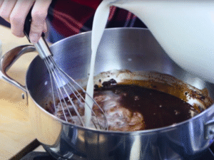 Slowly add your choice of almond, oat, soy, or other non-dairy milk. Keep whisking to blend everything smoothly.